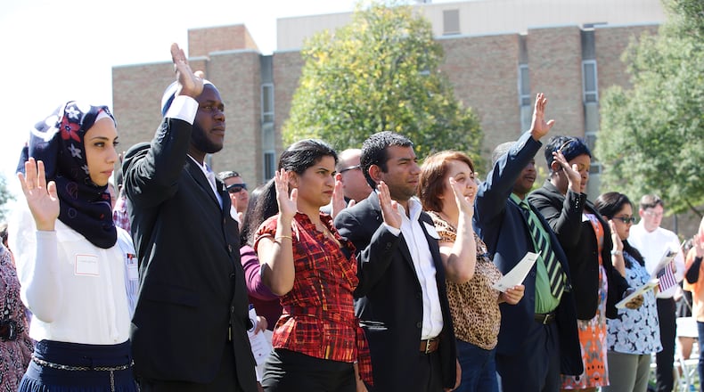 Pictured is new citizens being sworn in at the U.S. District Court for the Southern District of Ohio Naturalization Ceremony, at Miami University in September, 2016. CONTRIBUTED