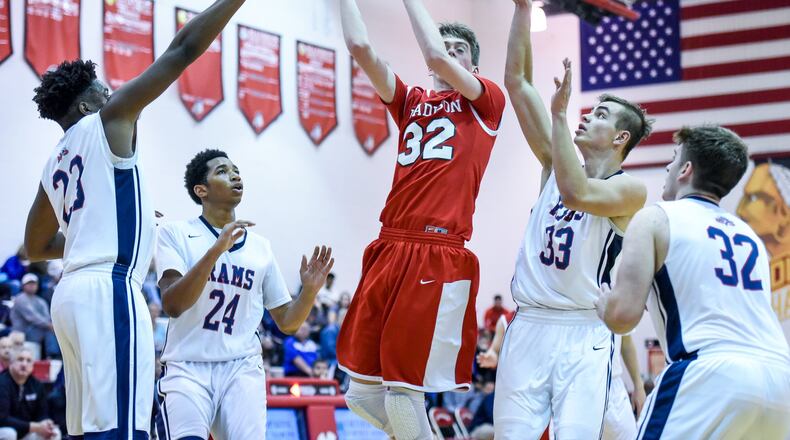 Madison’s Grant Whisman puts up a shot through a group of Miami Valley defenders during their game in the Brian Cook Classic on Dec. 29, 2016, at Madison. NICK GRAHAM/STAFF
