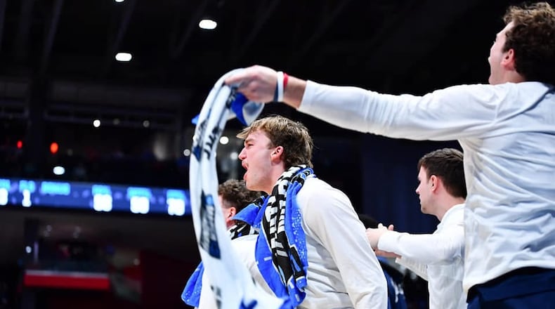 Xavier's Ian Sabourin, a 2022 Badin High School graduate, celebrates during the Musketeers' NCAA Tournament First Four game against Texas on Wednesday night at University of Dayton Arena. Kyle Hendrix/CONTRIBUTED PHOTO
