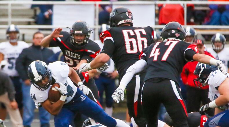 Edgewood fullback Elijah Williams (24) falls forward for extra yards during a Sept. 1 game against Franklin at Atrium Stadium in Franklin. The host Wildcats won 49-21. GREG LYNCH/STAFF