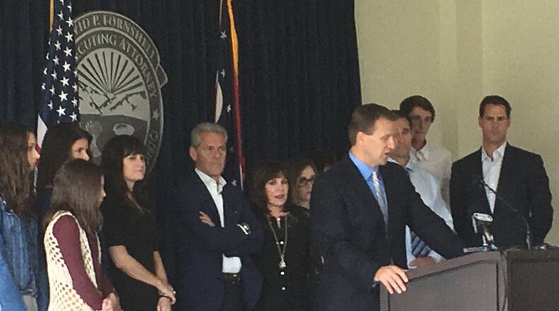Members of Dick Woods’ family flanked Warren County Prosecutor David Fornshell after the plea and sentencing of his kiler. Staff photo by Lawrence Budd