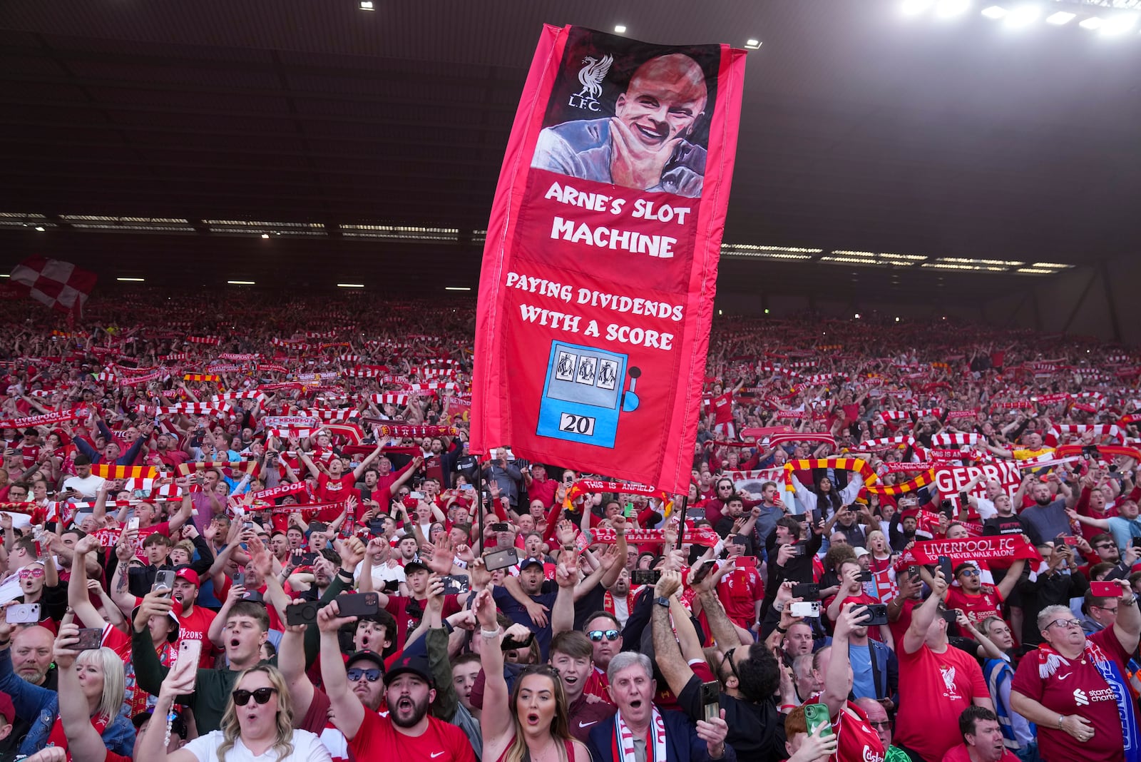 Liverpool supporters celebrate after their team won the English Premier League soccer match between Liverpool and Tottenham Hotspur and clinched the Premier League title at Anfield in Liverpool, England, Sunday, April 27, 2025. (AP Photo/Jon Super)