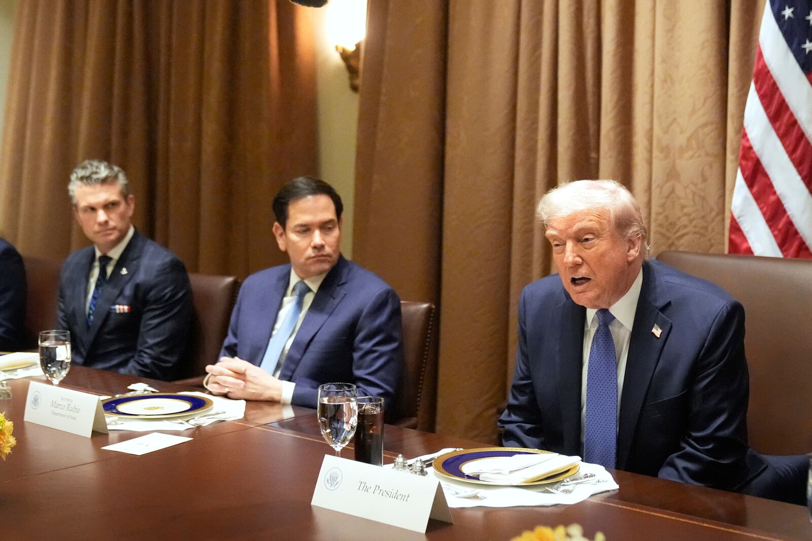 FILE - President Donald Trump, from right, speaks as as Secretary of State Marco Rubio and Secretary of Defense Pete Hegseth listen during a bilateral luncheon in the Cabinet Room of the White House, April 24, 2025, in Washington. (AP Photo/Mark Schiefelbein, File)