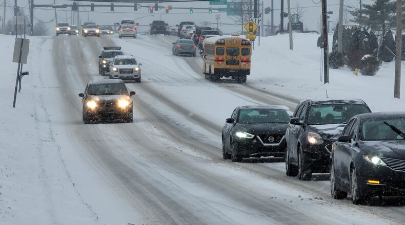 Snow blanketed Butler County causing slick roads and school closings. NICK GRAHAM / STAFF