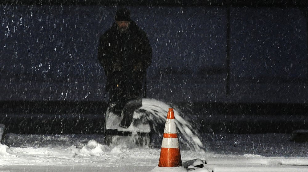 Snowy weather Friday morning, Jan. 19, 2024 had people starting their snowblowers to clear driveways and sidewalks in Fairborn. MARSHALL GORBY\STAFF