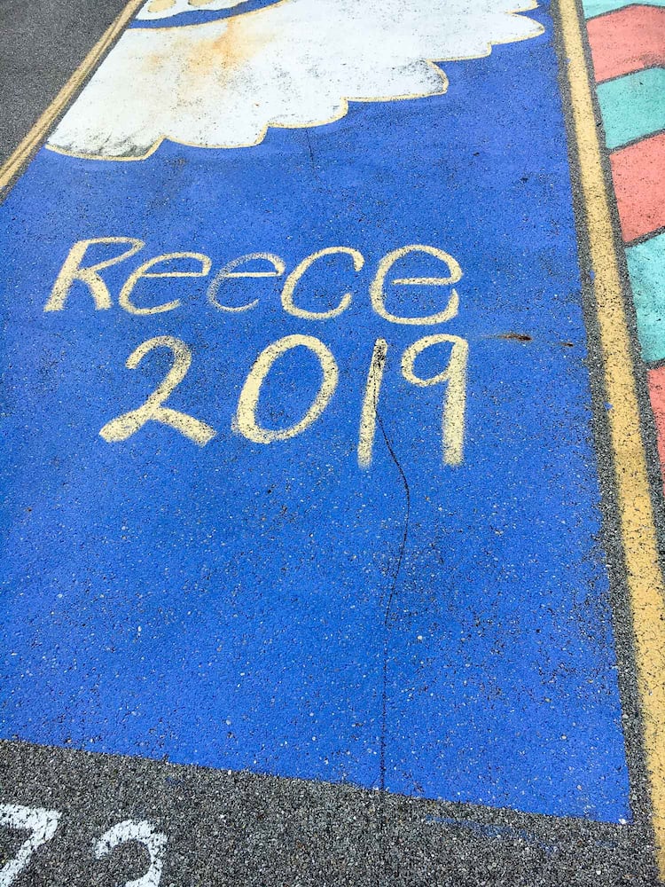 PHOTOS Lakota East seniors paint parking spots