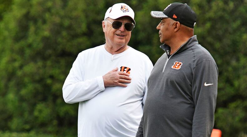 Head coach Marvin Lewis, right, and owner Mike Brown stand on the sideline during rookie camp for the Cincinnati Bengals Friday, May 6 at the practice fields next to Paul Brown Stadium in Cincinnati. NICK GRAHAM/STAFF