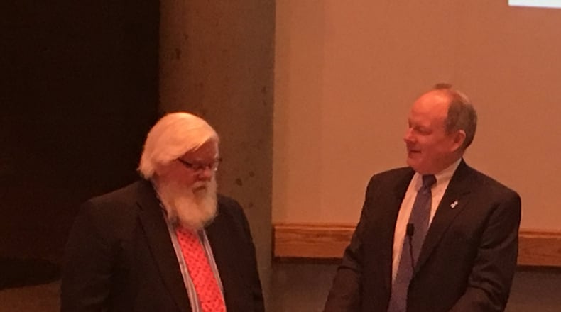 Middletown Law Director Les Landen, left, was recognized by Middletown Mayor Larry Mulligan during Tuesday’s City Council meeting. Landen is retiring after nearly 30 years. RICK McCRABB/STAFF