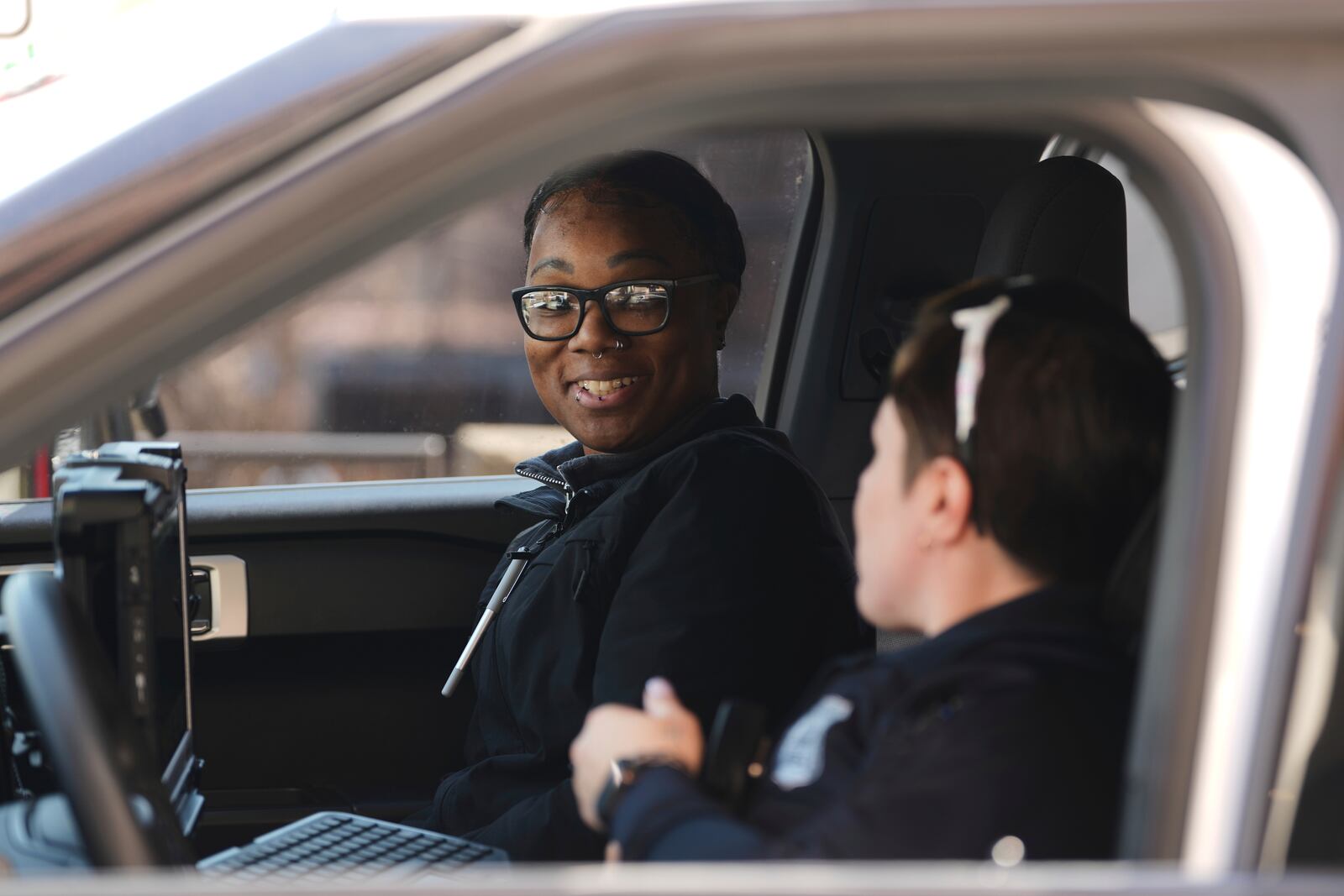 Crisis Intervention Response Team (CIRT) members Therapist Krystian Gardner, left, and Philadelphia Police Officer Vanity Cordero talk after a call in Philadelphia, Friday, March 14, 2025. (AP Photo/Matt Rourke)