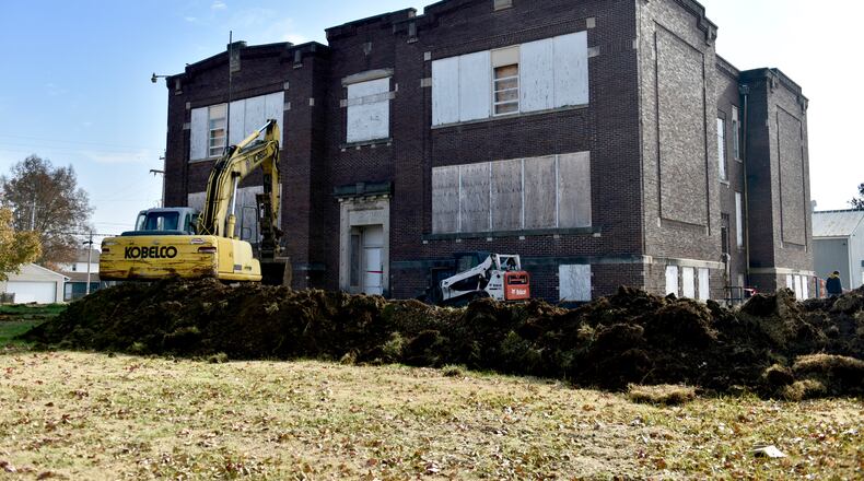 Demolition is slated to start this week in the old Taylor School building in the Lindenwald neighborhood of Hamilton. Preliminary work was underway Tuesday, Nov. 19. NICK GRAHAM/STAFF