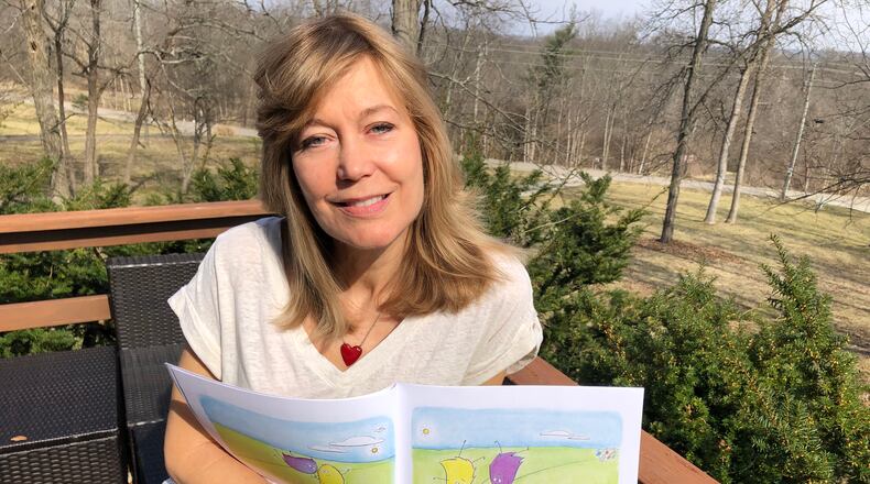 Marianne Reed recently released her first children's book, "The Boogies and the Woogies." She wrote and illustrated the 27-page book. RICK McCRABB/STAFF