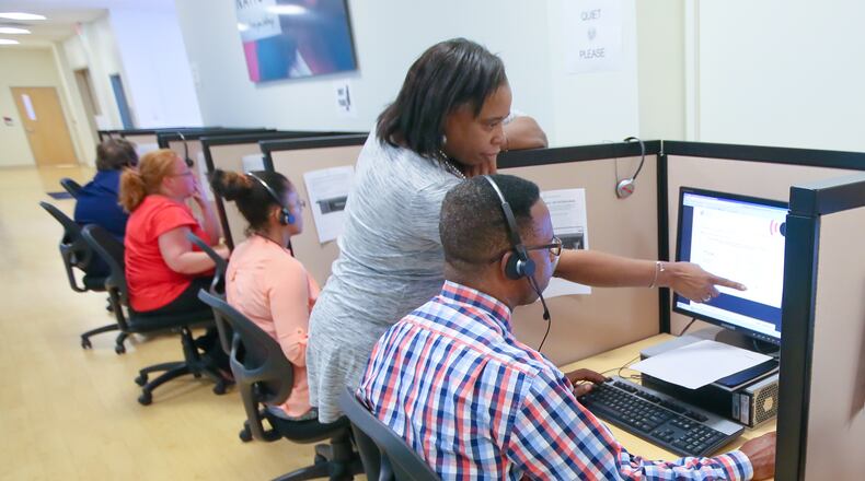 Cynthia Coleman of Startek, sets up an initial assessment screening for job applicant Will Granville during Startek’s open house and career fair, Thursday, Sept. 1, 2016, in . Startek is hiring customer service representatives and STNAs and offering a $250 sign-on bonus for anyone hired for a December start. GREG LYNCH / STAFF
