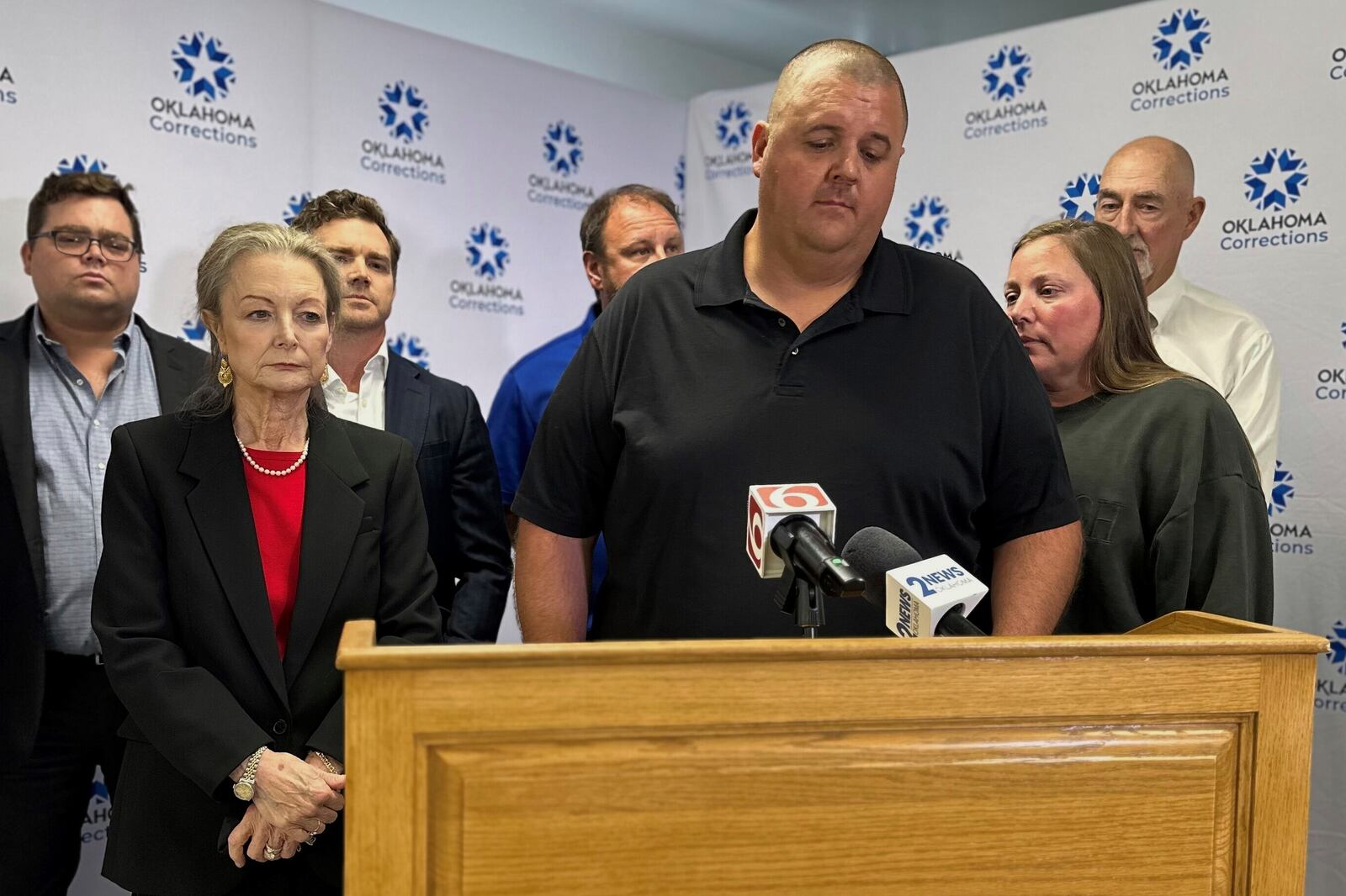 Jacob Thurman, the son of Jerald Thurman, speaks to reporters, as Sara Mooney, the niece of Mary Bowles, listens, after witnessing the execution of John Fitzgerald Hanson in Oklahoma on Thursday, June 12, 2025, at the Oklahoma State Penitentiary in McAlester. (AP Photo by Sean Murphy)