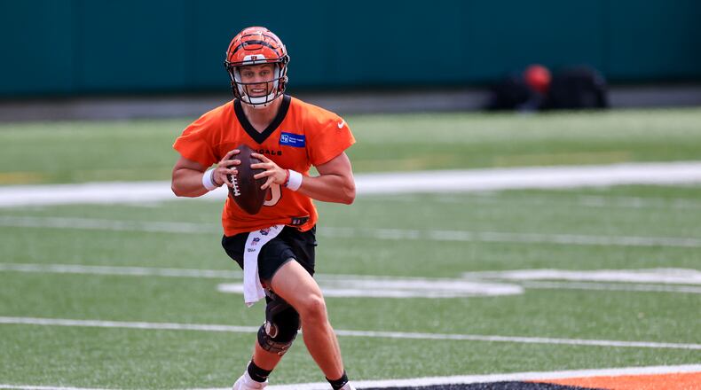 Cincinnati Bengals' Joe Burrow looks to pass in a drill during an NFL football minicamp practice in Cincinnati, Tuesday, June 15, 2021. (AP Photo/Aaron Doster)