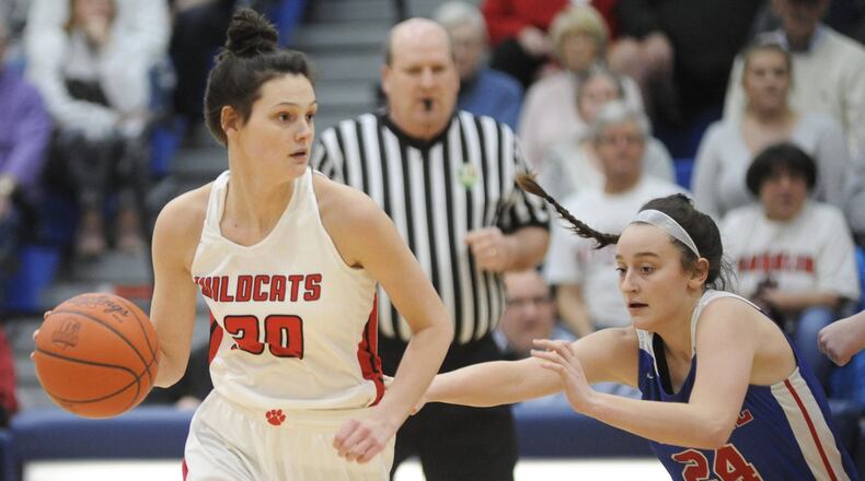 Layne Ferrell of Franklin (with ball) is chased by Carroll’s Allie Stefanek during a Division II regional basketball final March 8 at Springfield. Carroll won 57-43. MARC PENDLETON/STAFF