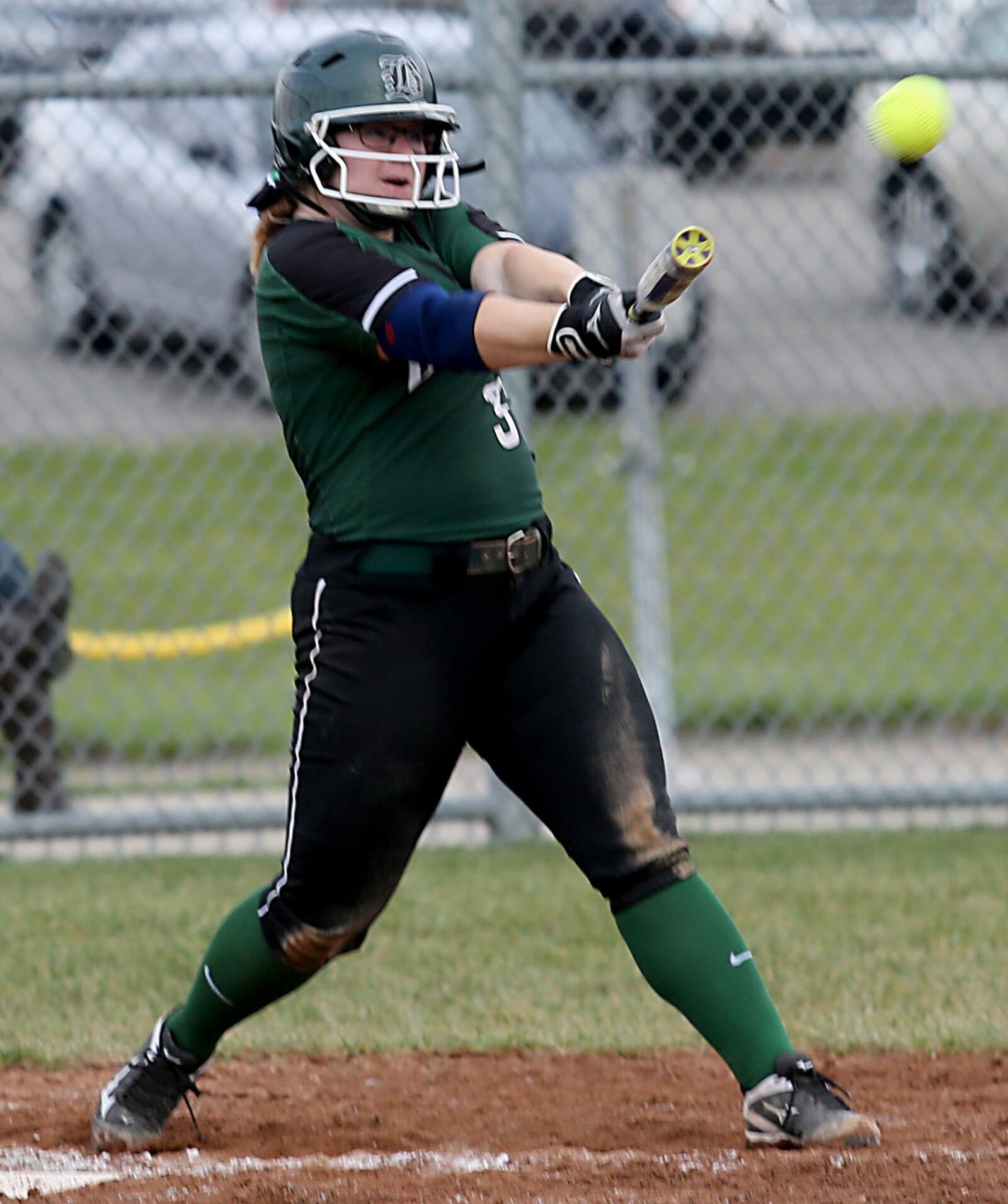 Badin’s Maddie Curtner smacks one of her two run-scoring doubles against Wilmington at Mueller Stadium in Hamilton on Monday. CONTRIBUTED PHOTO BY E.L. HUBBARD