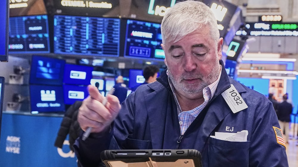 Trader Edward McCarthy works on the floor of the New York Stock Exchange, Wednesday, Feb. 11, 2026. (AP Photo/Richard Drew)