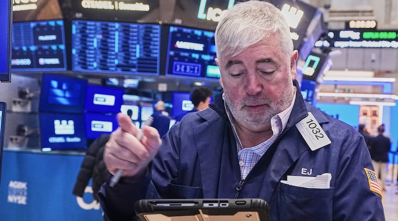 Trader Edward McCarthy works on the floor of the New York Stock Exchange, Wednesday, Feb. 11, 2026. (AP Photo/Richard Drew)