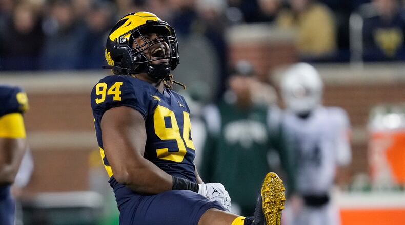 Michigan defensive lineman Kris Jenkins (94) reacts to a tackle against Michigan State in the second half of an NCAA college football game in Ann Arbor, Mich., Saturday, Oct. 29, 2022. (AP Photo/Paul Sancya)