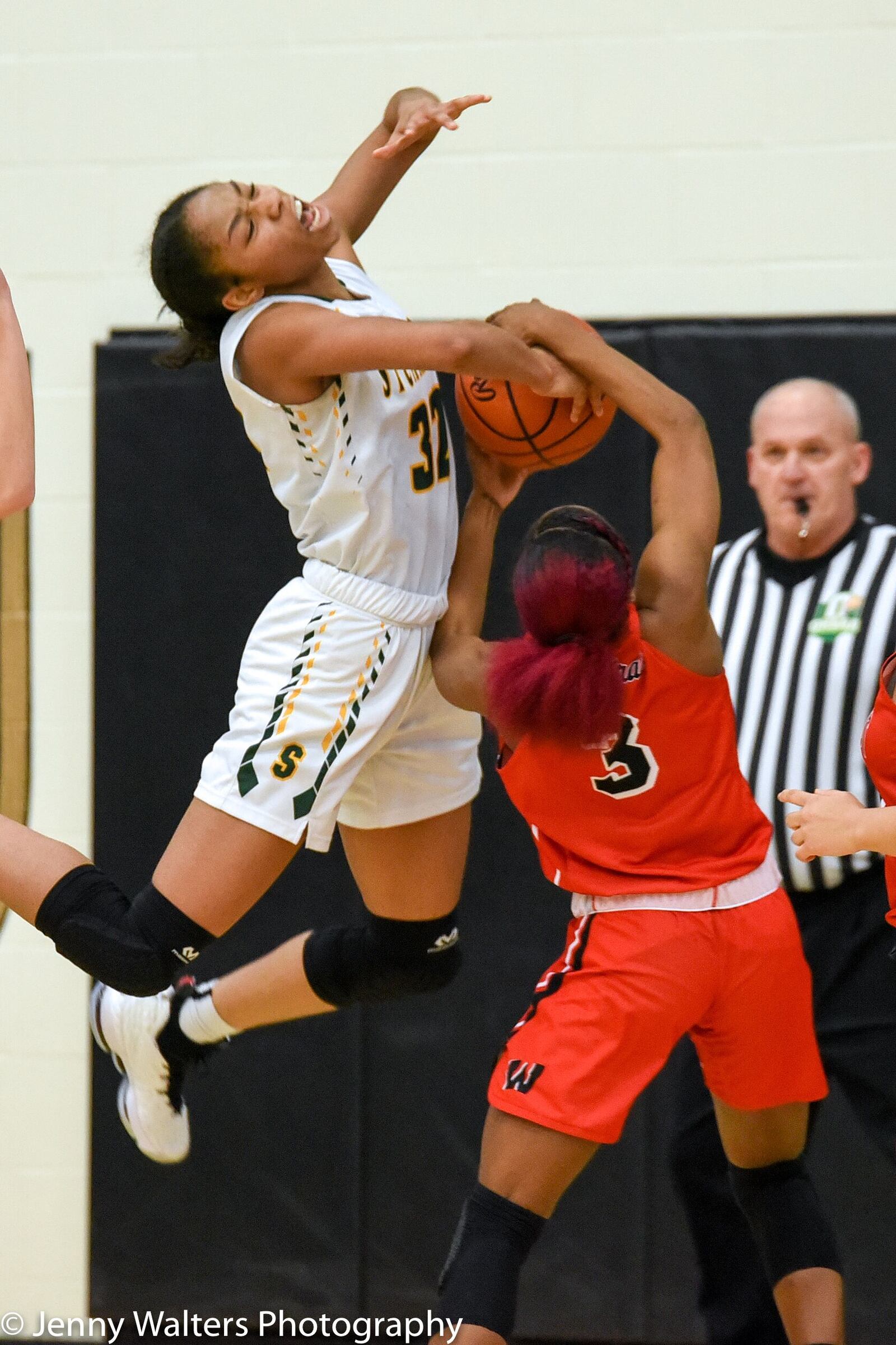 Lakota West's Sydney Benning (3) battles Sycamore's Aliah McWhorter for the ball during Monday night's Division I district basketball semifinal at Lakota East. West won 50-35. PHOTO COURTESY OF JENNY WALTERS PHOTOGRAPHY