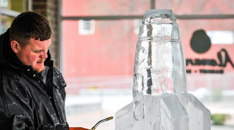Jonathon Michael, lead carver with Artic Diamond Ice Sculptures, created a sculpture of a rocket during a media preview event for IceFest 2017 in Hamilton. NICK GRAHAM/STAFF