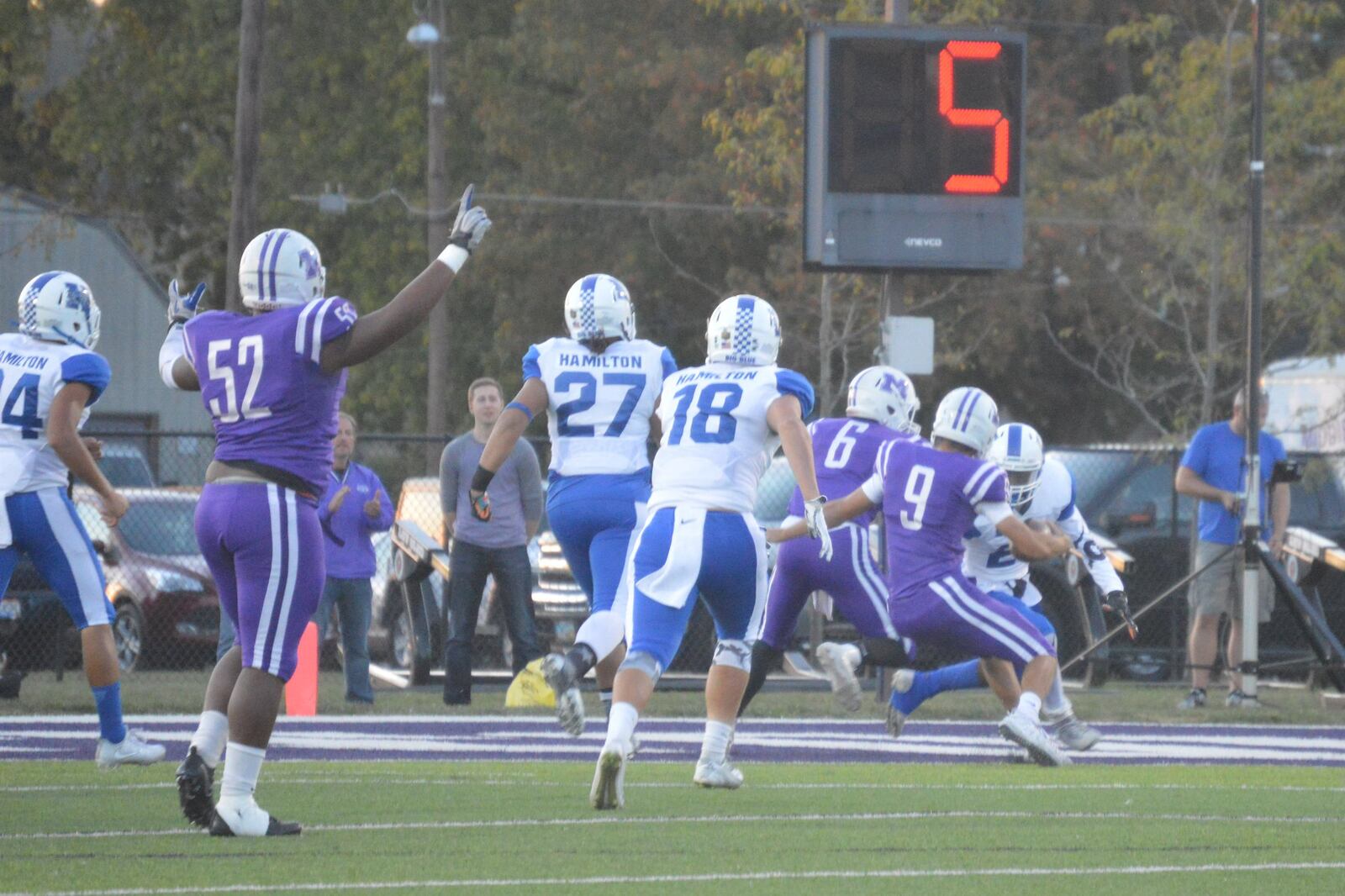 Middletown quarterback Zach Maloney (9) is about to score a touchdown as teammate Keion Williams (52) celebrates during Friday night’s game against Hamilton at Barnitz Stadium in Middletown. CONTRIBUTED PHOTO BY MARITZA MCKINNEY