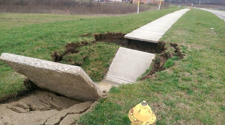 The city of Hamilton is proposing to increase its storm water sewer rates in 2025 and 2026 by $2 in each of those years. Storm sewer rates are currently a flat $5 per month per residential customer, and would increase to $7 per month in 2025 and $9 per month in 2026. Commercial storm water rates vary from business to business as it's based on the amount of impervious area on the property. Pictured in this 2018 photo is a sink hole over a corrugated metal pipe on Eden Park Drive. PROVIDED