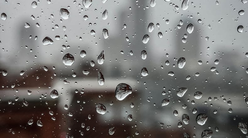The Dayton skyline thru a rain covered window in downtown Dayton.