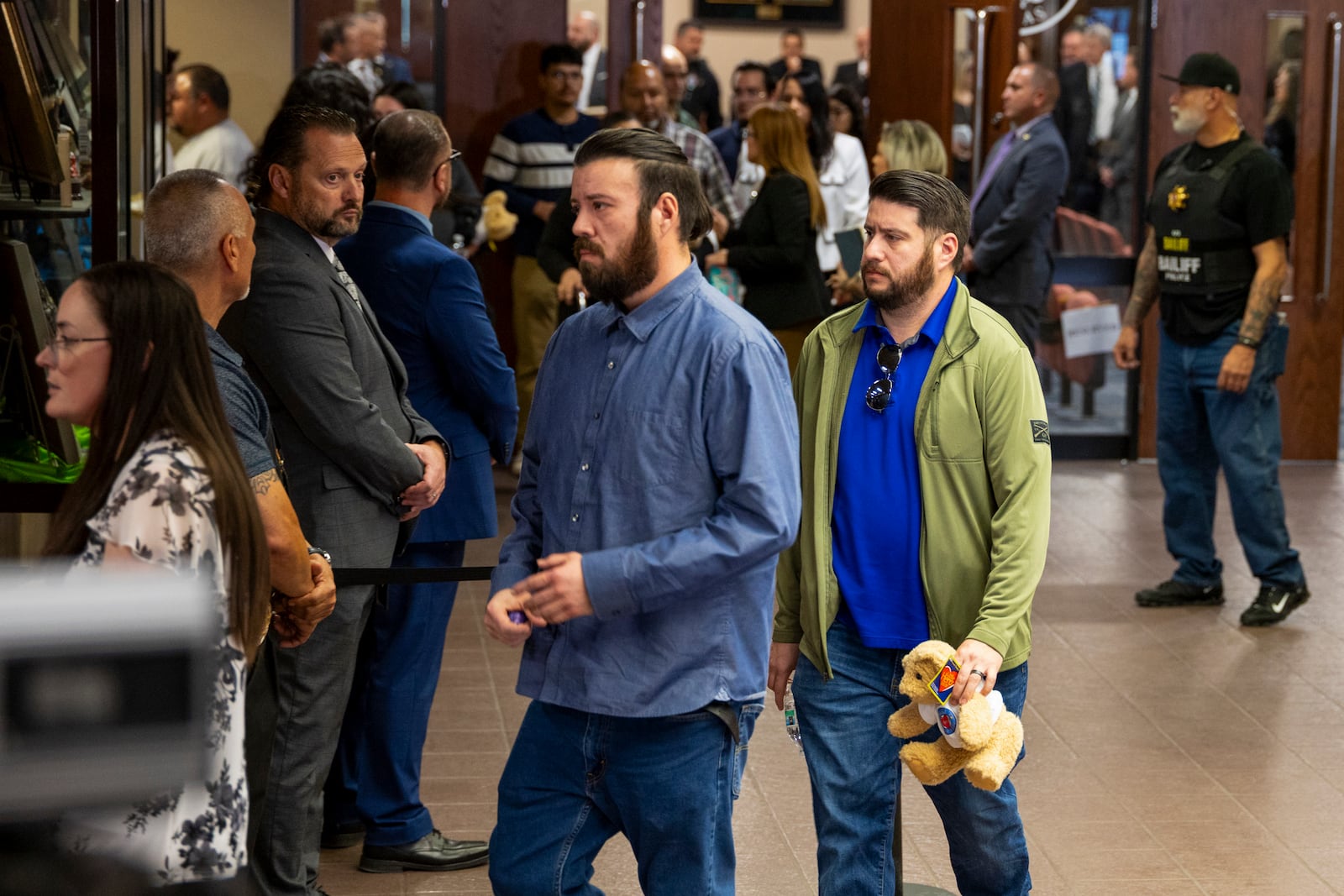 Families embrace as they leave the 409th District Court after Patrick Crusius pleaded guilty in the death of 23 people in the Aug. 3. 2019 Walmart Mass shooting, Monday, April 21, 2025, in El Paso, Texas. (AP Photo/Ivan Pierre Aguirre)
