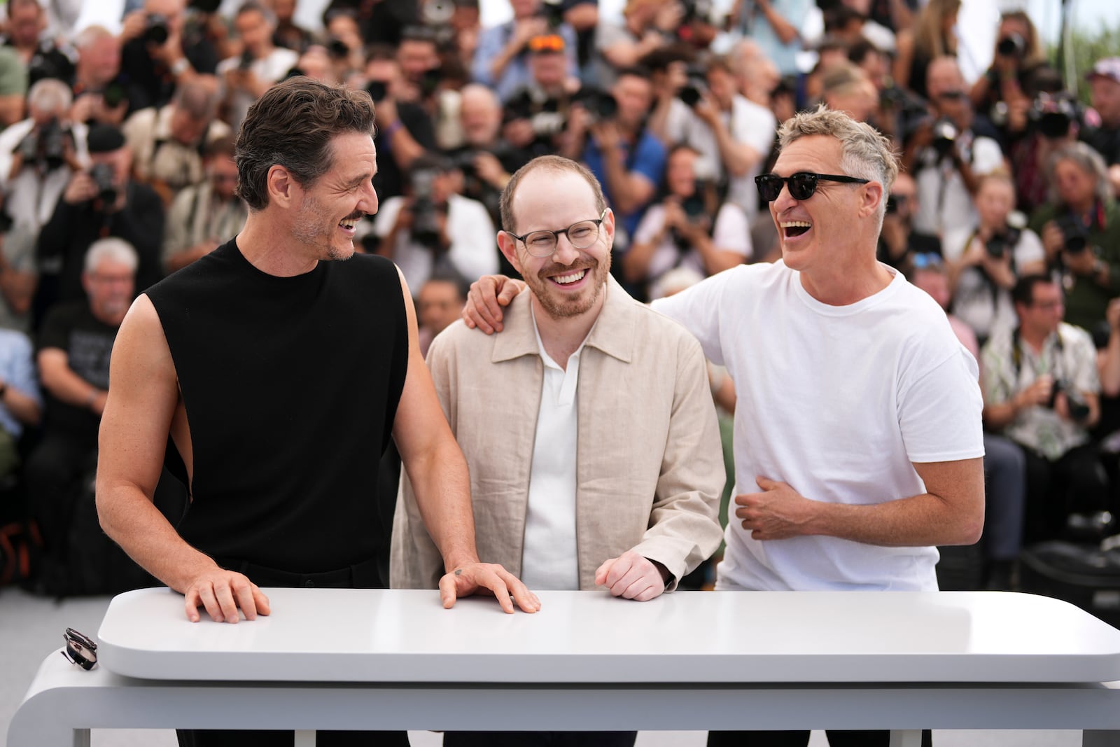 Pedro Pascal, from left, director Ari Aster and Joaquin Phoenix pose for photographers at the photo call for the film 'Eddington' at the 78th international film festival, Cannes, southern France, Saturday, May 17, 2025. (Photo by Scott A Garfitt/Invision/AP)