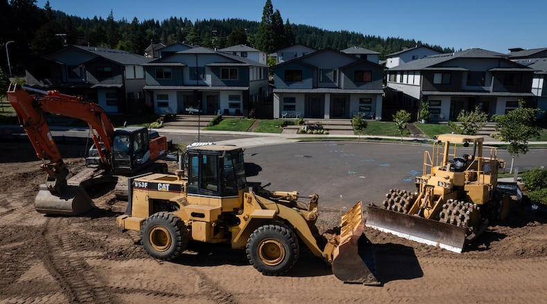 FILE - Construction equipment is seen near new homes on July 11, 2025, in Happy Valley, Ore. (AP Photo/Jenny Kane, File)