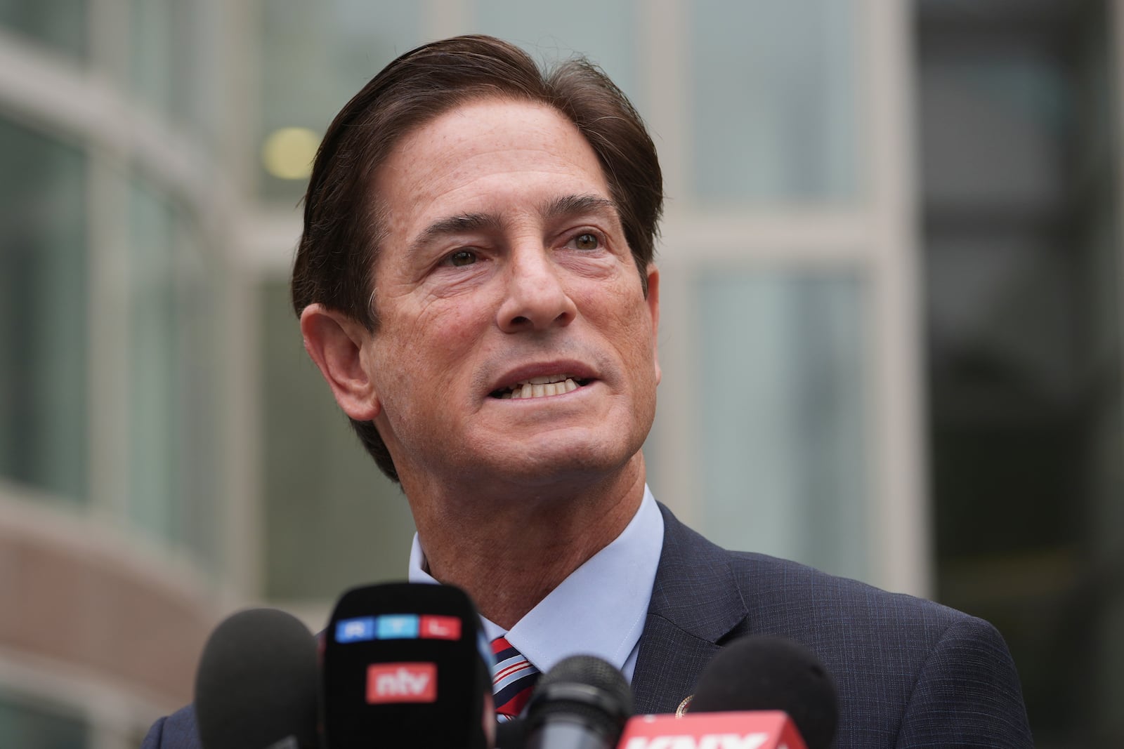 Los Angeles County District Attorney Nathan Hochman speaks outside of the courthouse during a hearing in the case of Erik and Lyle Menendez Thursday, April 17, 2025, in Los Angeles. (AP Photo/Damian Dovarganes)