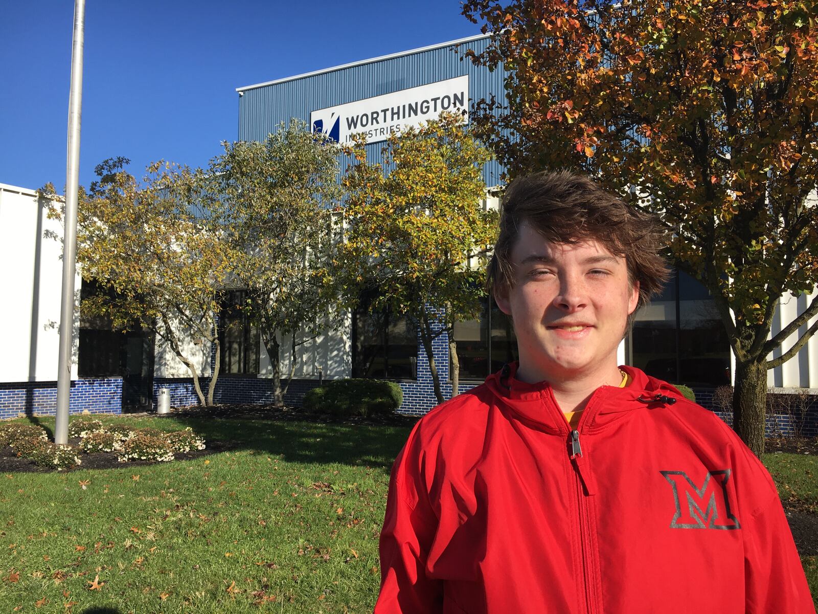 Miami University's second-year Work Plus tuition work program recently doubled its participating area companies from three to six and this school year Worthington Industries, a steel processing company in Monroe, is one of the happy newcomers. Also new to the program is Miami regional freshman Carter Waye (pictured outside of Worthington's facility in Monroe), who says he can't believe his improved chances of graduating debt free through the program. (Photo By Michael D. Clark\Journal-News)