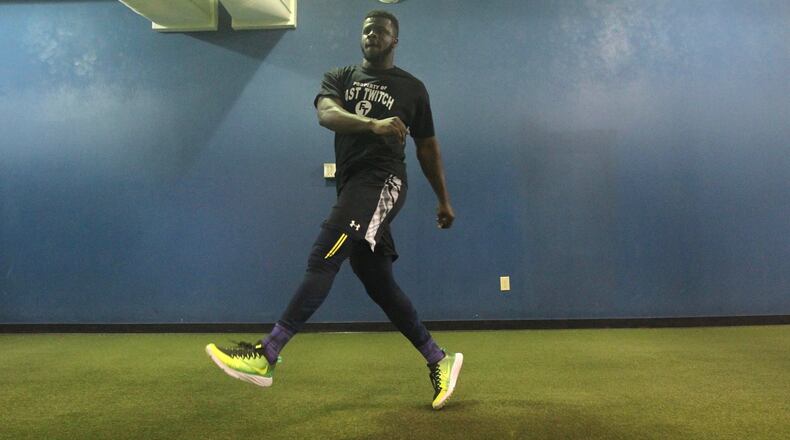 Ifeadi Odenigbo works out at Fast Twitch Sports Performance in Dayton on Wednesday, May 3, 2017. David Jablonski/Staff
