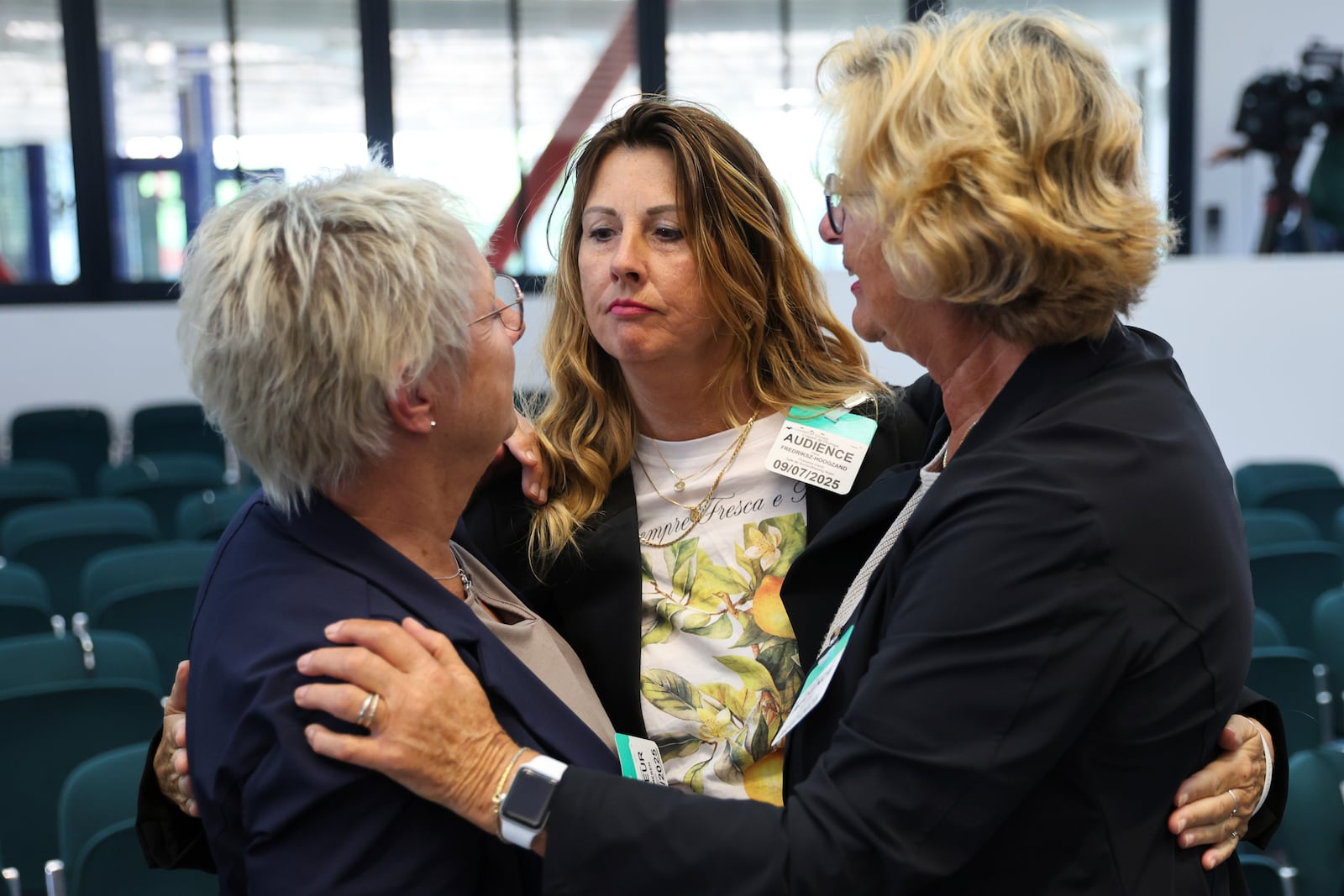 Netherlands' Silene Fredriksz-Hoogzand, center, whose son died in in the MH17 crash, hugs other plaintiffs after the European Court of Human Rights issued its judgment on Russian violations in Ukraine since 2014, including the downing of Malaysia Airlines flight MH17, Wednesday, July 9, 2025 in Strasbourg, eastern France. (AP Photo/Antonin Utz)