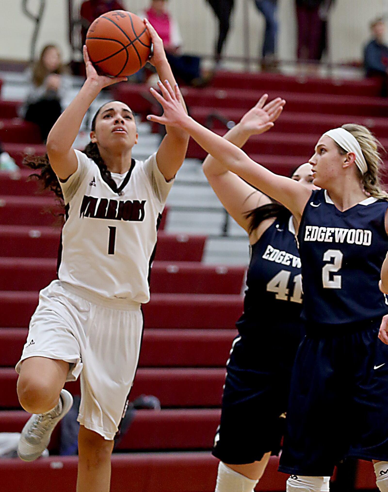 Lebanon guard Alexis Straw puts up a shot as Edgewood guard Jessa Brown (2) defends during Monday night’s game at Lebanon. CONTRIBUTED PHOTO BY E.L. HUBBARD