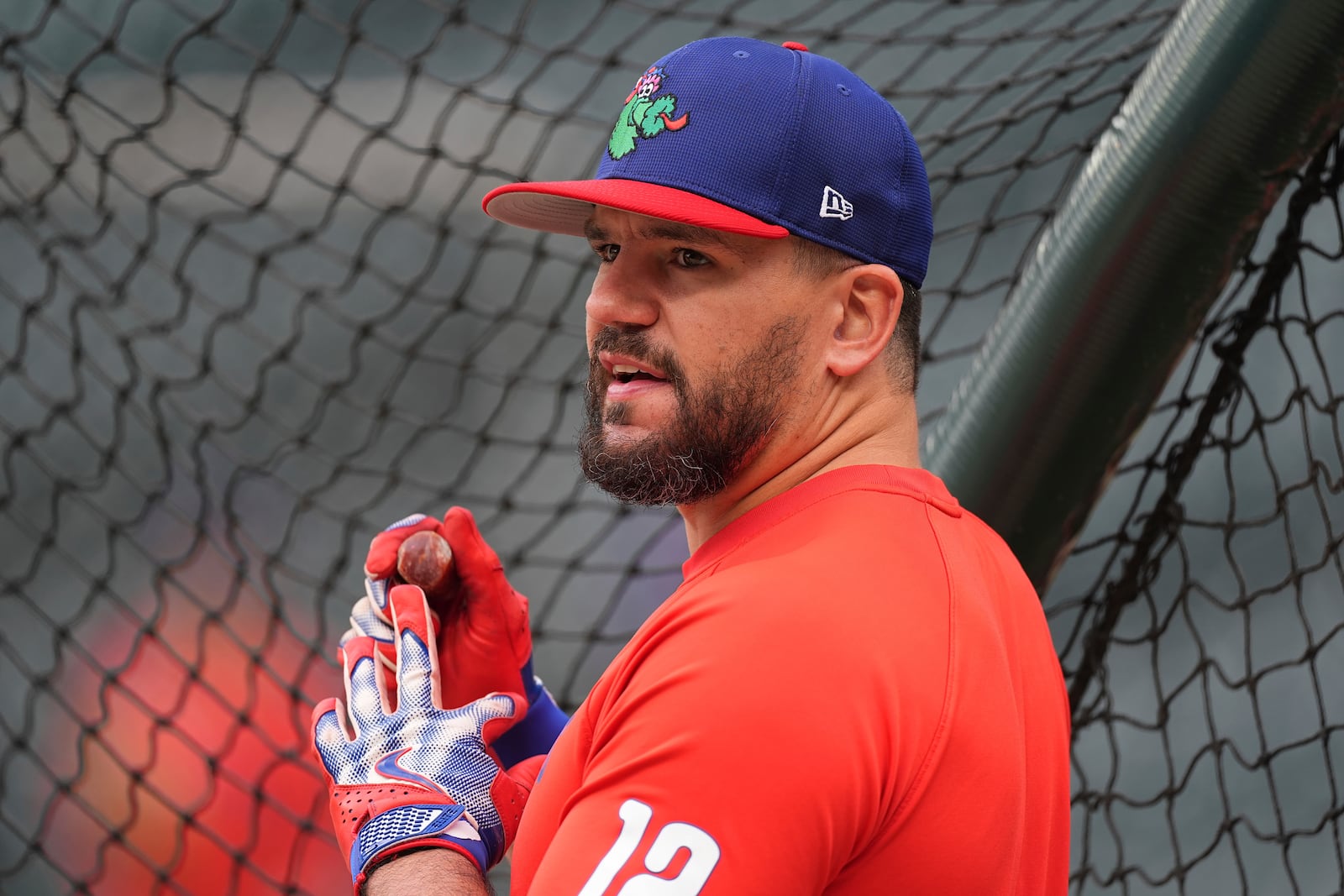 Philadelphia Phillies outfielder Kyle Schwarber warms up before a baseball game against the Colorado Rockies, Monday, May 19, 2025, in Denver. (AP Photo/David Zalubowski)