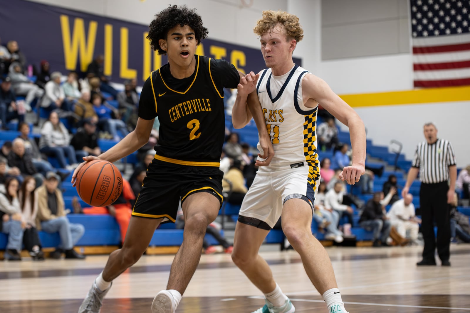 Centerville freshman Julian Sam drives past Springfield junior Preston Burkhardt during their Greater Western Ohio Conference game on Tuesday, Feb. 3, 2026. The Elks won 56-44. MICHAEL COOPER / STAFF