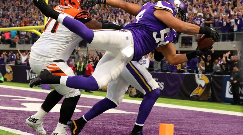 MINNEAPOLIS, MN - DECEMBER 17: Eric Kendricks #54 of the Minnesota Vikings dives with the ball for a touchdown after intercepting Andy Dalton #14 of the Cincinnati Bengals in the first quarter of the game on December 17, 2017 at U.S. Bank Stadium in Minneapolis, Minnesota. (Photo by Adam Bettcher/Getty Images)