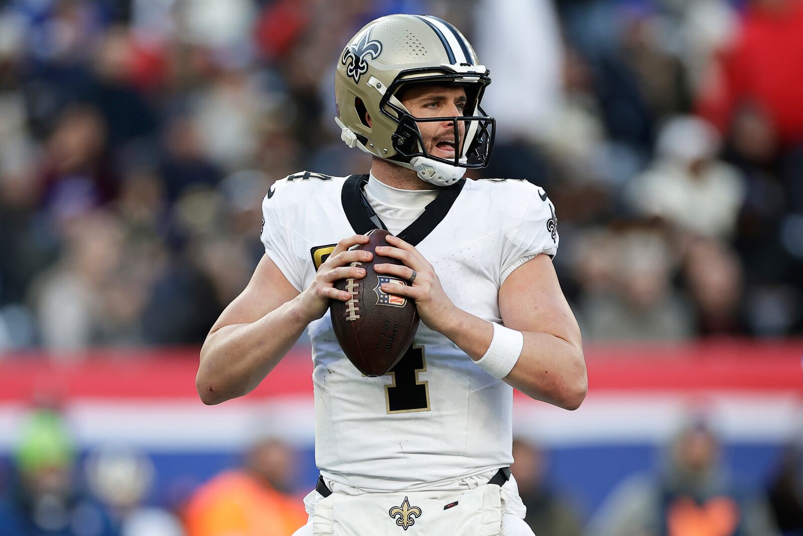FILE - New Orleans Saints quarterback Derek Carr (4) looks to pass the ball during an NFL football game against the New York Giants, Dec. 8, 2024, in East Rutherford, N.J. (AP Photo/Adam Hunger, File)