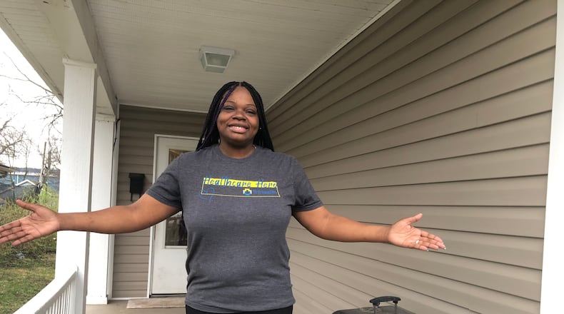 Adriane Carruth, who once was homeless, recently closed on a house in Middletown where she lives with her husband and two children. RICK McCRABB/STAFF