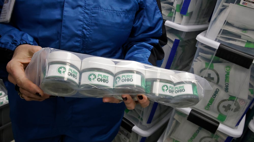 Some of the packaged cannabis ready for the dispensary Monday, Dec. 4, 2023 at the Pure Ohio Wellness production facility in Clark County. BILL LACKEY/STAFF