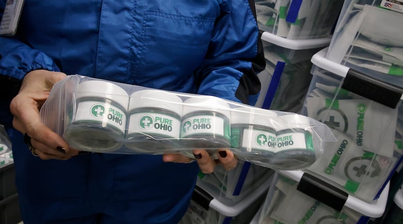 Some of the packaged cannabis ready for the dispensary Monday, Dec. 4, 2023 at the Pure Ohio Wellness production facility in Clark County. BILL LACKEY/STAFF