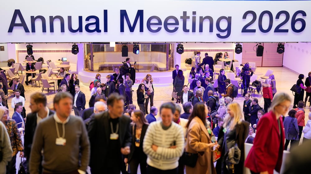 People leave on the final day of the Annual Meeting of the World Economic Forum, Switzerland, Friday, Jan. 23, 2026. (AP Photo/Markus Schreiber)