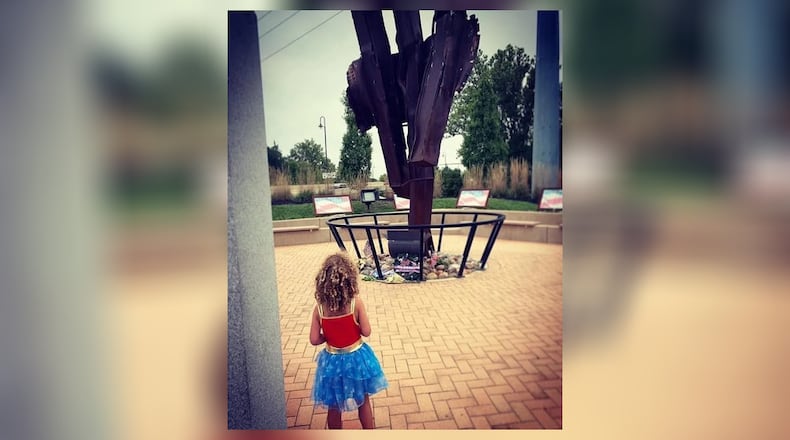 Pamela’s daughter, Jasmine, visiting the 9/11 Memorial in Beavercreek which features a 3-ton steel of the North Tower of the World Trade Center. The memorial is located at 1153 N. Fairfield Road. CONTRIBUTED