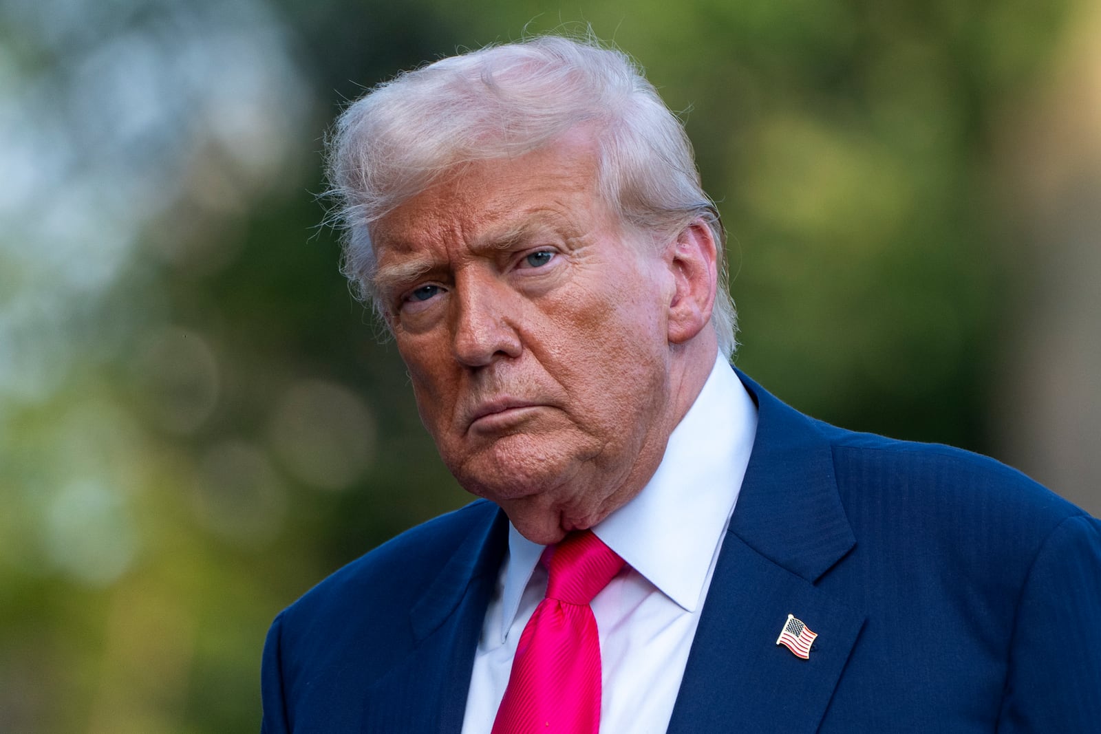 FILE - President Donald Trump walks from Marine One after arriving on the South Lawn of the White House, Tuesday, July 15, 2025, in Washington. (AP Photo/Alex Brandon, File)