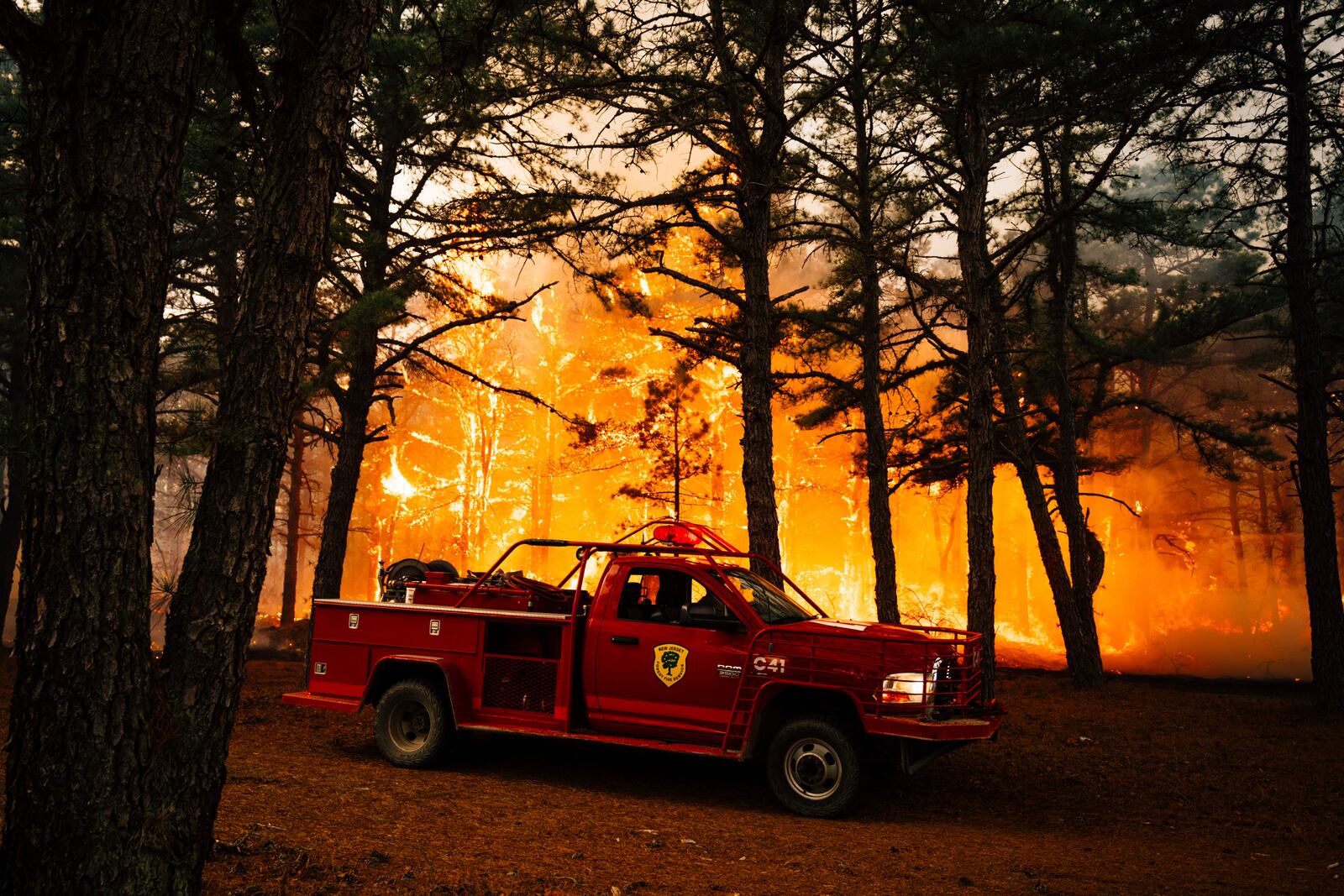 Firefighters battle a wildfire in Ocean County, N.J. on Thursday, April 24, 2025. (New Jersey Department of Environmental Protection via AP)