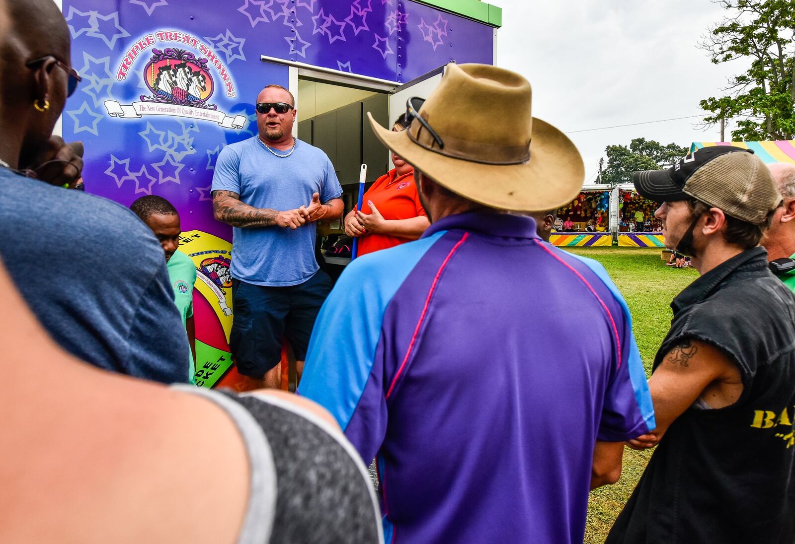 Russell Clements is the manager of Cincinnati-based Triple Treat Shows, the operator of rides at the Butler County Fair. He is shown conducting a morning safety meeting Thursday, July 27, with employees during the Butler County Fair in Hamilton. 
