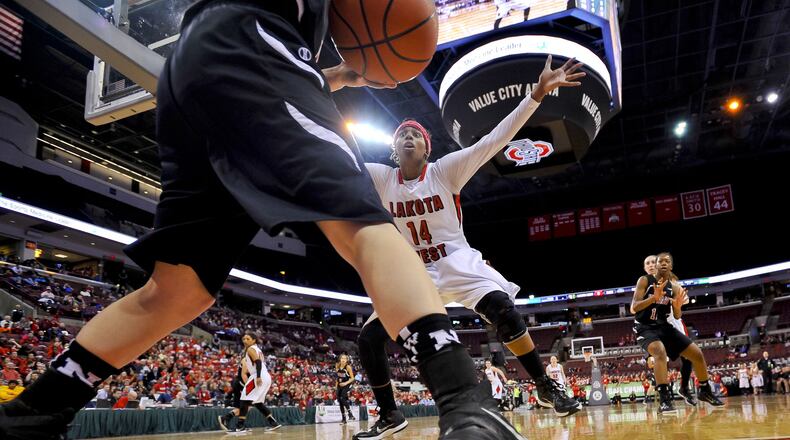 Lakota West’s Arianne Whitaker tries to stop an inbounds play during a Division I state basketball semifinal against Newark at the Schottenstein Center in Columbus on March 20, 2015. West won 53-50. NICK GRAHAM/STAFF