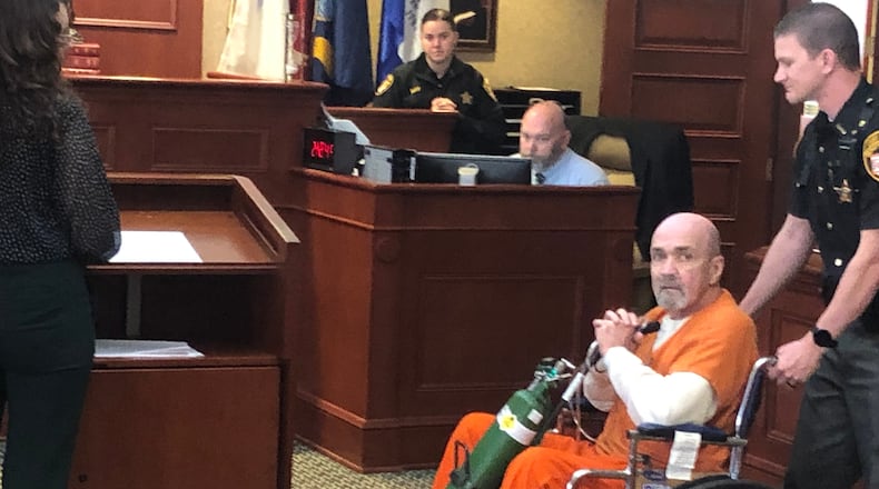 Thomas Edward Philpot, 63, of Hamilton, indicted on multiple child sex charges, including rape, is wheeled into Butler County Common Pleas Court Monday afternoon by a Butler County Sheriff deputy. Philpot wanted his $75,000 bond lowered to $25,000 due to his medical issues. The judge denied his request. RICK McCRABB/STAFF